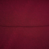 A red midi dress with ruched detailing and a flap design named Camille