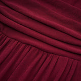 A red midi dress with ruched detailing and a flap design named Camille