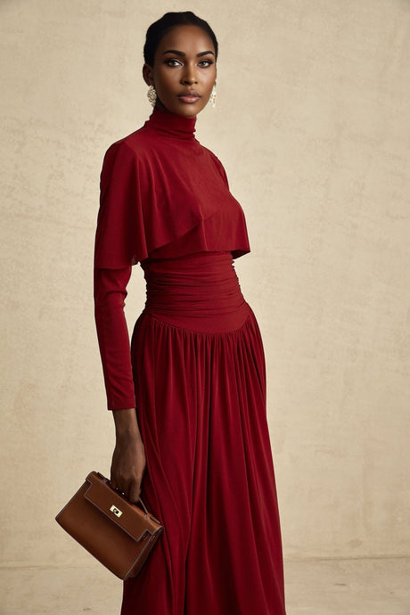 A red midi dress with ruched detailing and a flap design named Camille