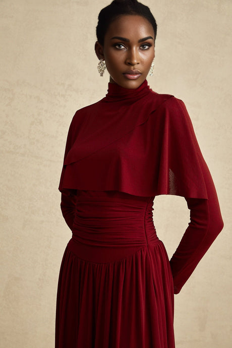 A red midi dress with ruched detailing and a flap design named Camille