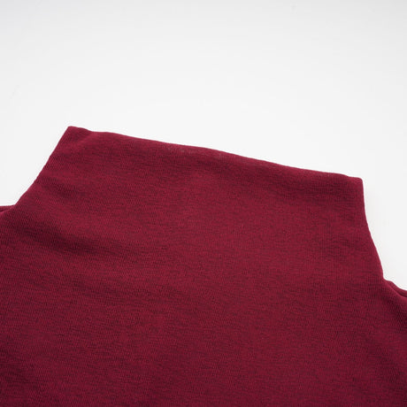 A red midi dress with ruched details and a flap design named Camille