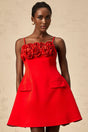 A red mini dress with a flared skirt featuring rose appliqués short sleeves and a fitted bodice