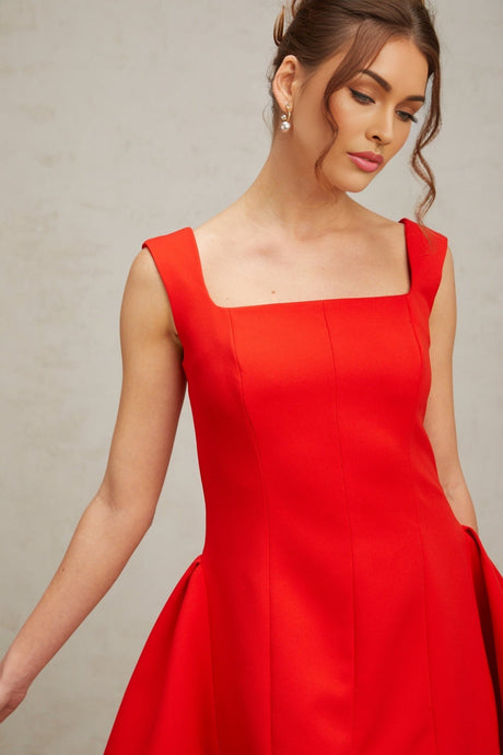 A red mini dress with a square neckline and puff sleeves featuring a Margherita design