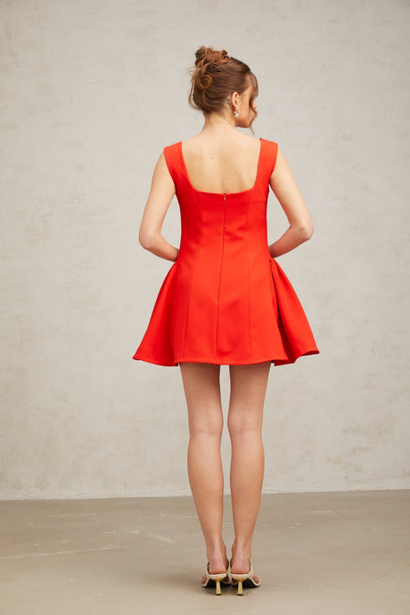A red mini dress with a square neckline and puff sleeves in a Margherita style
