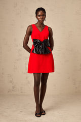 A red mini dress with a Vneckline and a sequin bow detail