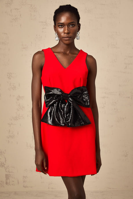 A red mini dress with a Vneckline featuring a sequin bow detail