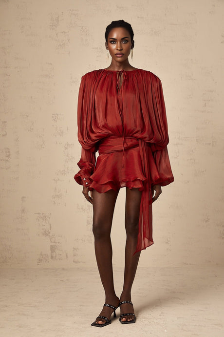 A red mini dress with full pleats and ruffles named Eugenie