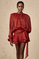 A red mini dress with full pleats and ruffles named Eugenie