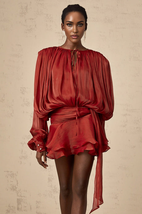 A red mini dress with full pleats and ruffles named Eugenie
