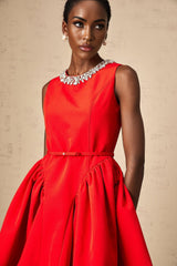 A red mini dress with pleated details and embellishments named Leonie