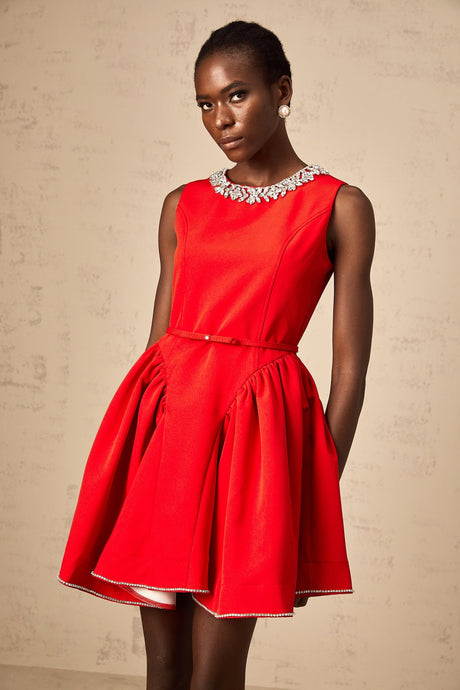 A red mini dress with pleated details and embellishments named Leonie
