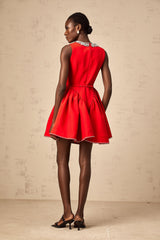 A red mini dress with pleated details and embellishments named Leonie