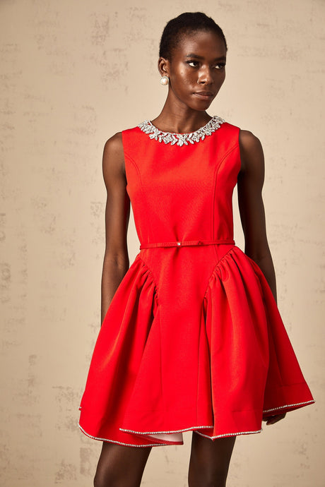A red mini dress with pleats and embellishments named Leonie
