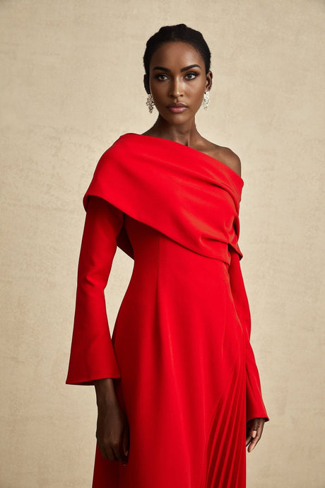 A red pleated maxi dress with a high slit perfect for Valentines Day featuring a long flowing skirt and romantic design