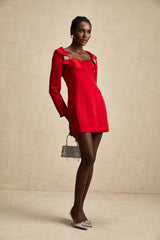 A red satin mini dress by Celine featuring a corset style bodice and a sleek silhouette