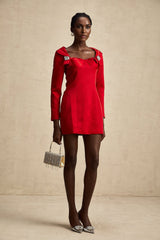 A red satin mini dress by Celine featuring a corset style design