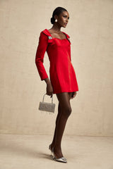 A red satin mini dress in corset style by Celine featuring a fitted bodice and short hemline