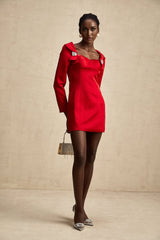 A red satin mini dress in corset style by Celine featuring a fitted bodice and short hemline