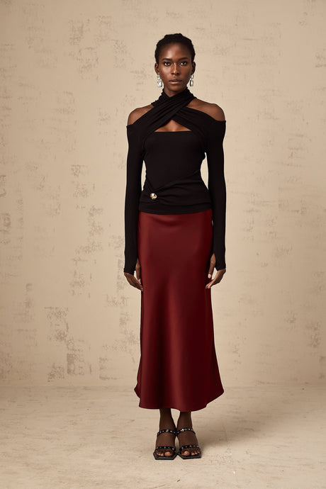 A red satin skirt with a flared silhouette called Vanessa