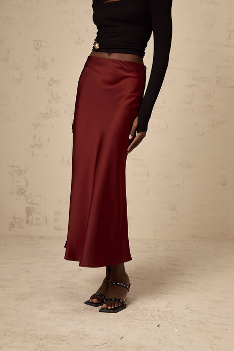 A red satin skirt with a flared silhouette named Vanessa