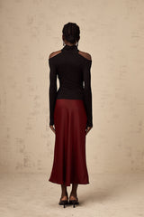 A red satin skirt with a flared silhouette named Vanessa