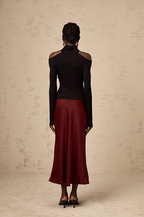 A red satin skirt with a flared silhouette named Vanessa
