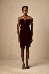 A red velvet mini dress with floral applique detailing by Maiwenn