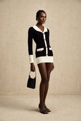 A ribbed knit mini dress made of wool featuring color blocking design in contrasting shades named Charlotte