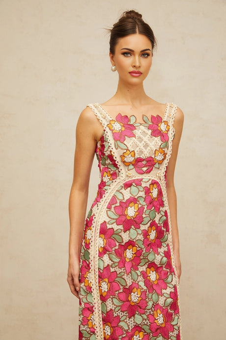 A rosepink midi dress with braided details and floral embroidery by Nalini