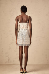 A short beaded mini dress featuring butterfly motifs and a Christine design