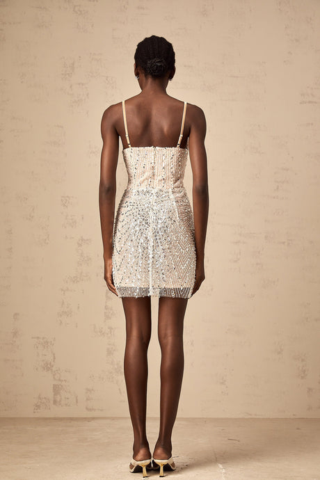 A short beaded mini dress featuring butterfly motifs and a Christine design