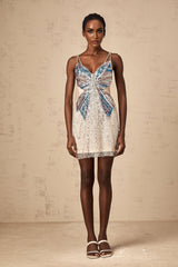 A short beaded mini dress with butterfly designs adorning the fabric elegant and feminine with a delicate pattern