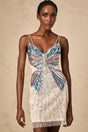 A short beaded mini dress with butterfly motifs covering the fabric featuring a light and delicate design suitable for evening wear or special occasions