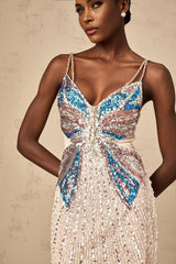 A short beaded mini dress with butterfly motifs featuring a colorful design on a light background