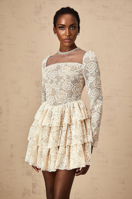 A short beige mini dress with delicate floral embroidery featuring a fitted bodice and flared skirt