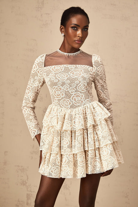 A short beige mini dress with delicate floral embroidery featuring a fitted bodice and flared skirt