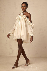 A short beige mini dress with ruffled details and delicate floral appliques in neutral tones