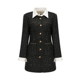 A short black dress with a tweed fabric base and sequin panels featuring a mini length and likely inspired by Audrey Hepburn style