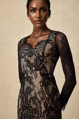 A short black lace mini dress with intricate floral embroidery covering the fabric featuring a fitted silhouette and delicate feminine design