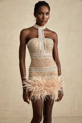 A short black mini dress with crystal embellishments and feather trim along the hemline and neckline