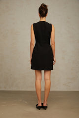A short black mini dress with sequin embellishments featuring a butterfly design