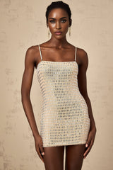 A short black mini dress with silver stud embellishments covering the fabric creating a shimmering effect The dress has a sleeveless design and a form fitting silhouette