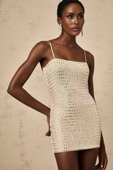 A short black mini dress with silver stud embellishments covering the fabric creating a sparkly texture and edgy look