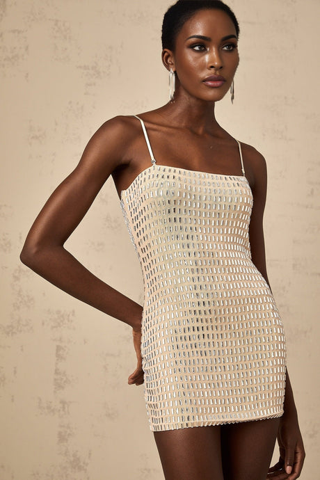 A short black mini dress with silver stud embellishments covering the fabric creating a sparkly texture and edgy look