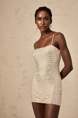 A short black mini dress with stud embellishments adorning the fabric creating a stylish and edgy look