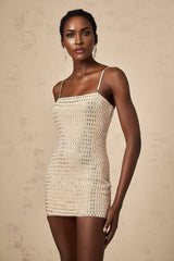 A short black mini dress with studded embellishments adorning the fabric featuring a sleek and edgy design