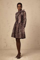 A short brown leopard print mini dress with a large bowknot detail and xylene inspired design