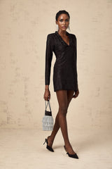 A short embellished mini dress with a plunging V neckline featuring studded details and a fitted silhouette
