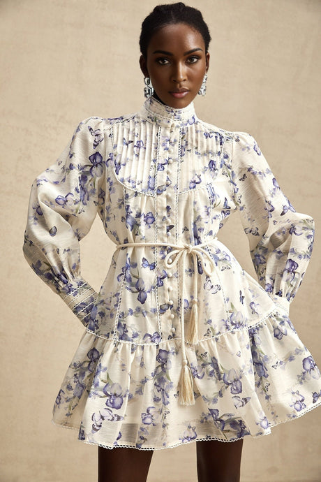 A short flared chiffon mini dress with a colorful floral print pattern called Blandine