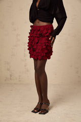 A short flared skirt with three dimensional petal shaped details creating a textured Aline silhouette in a mini length